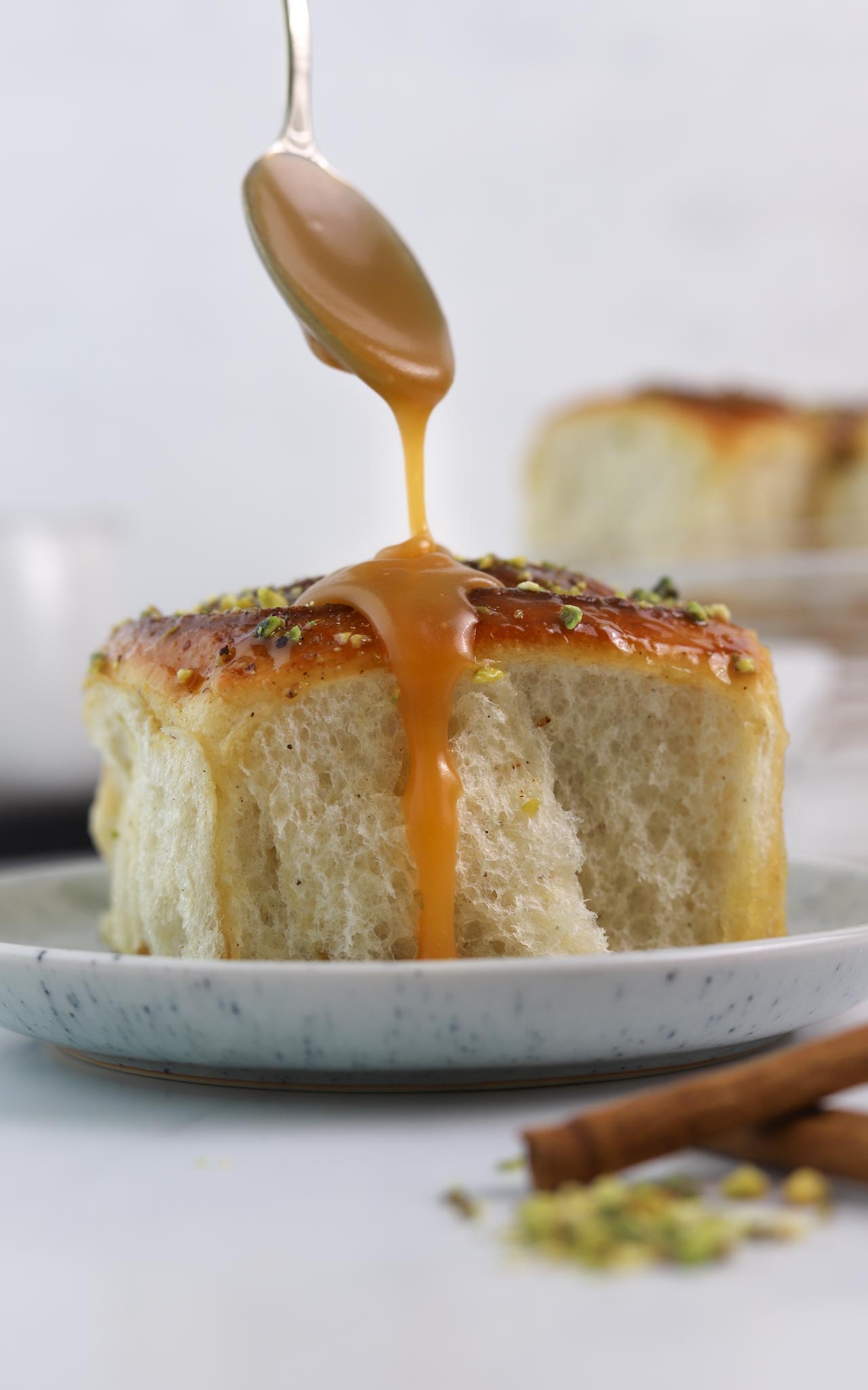 sourdough cinnamon rolls with caramel and pistachio